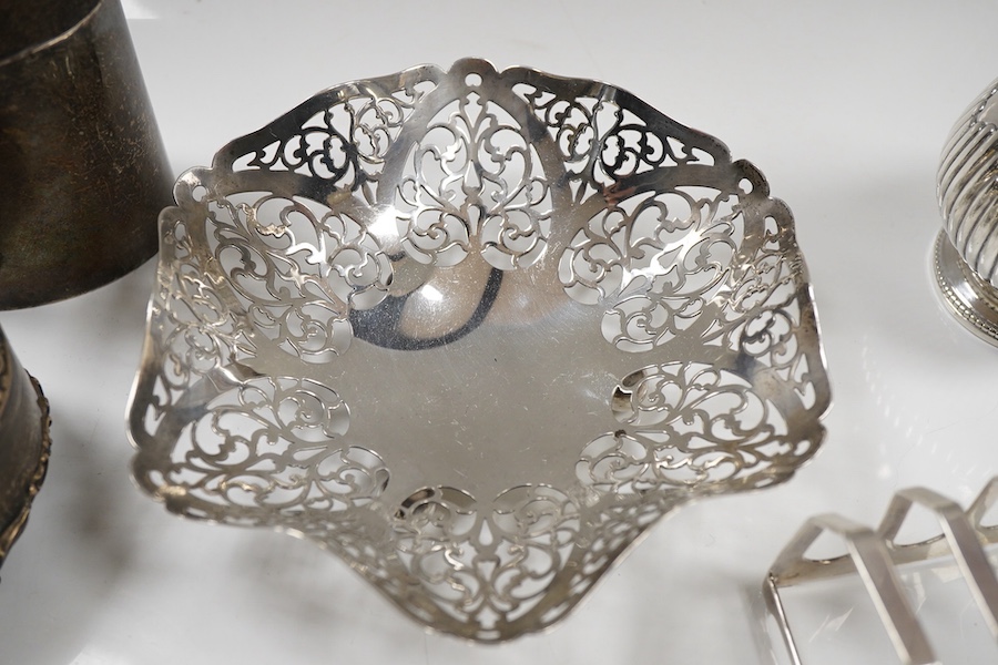Sundry small silver including an Edwardian oval tea caddy, Hasseler Brothers, London, 1901, 10.4cm, a pierced bonbon dish, a late Victorian cream jug, five napkin rings including two pairs, a seven bar toast rack, a dama